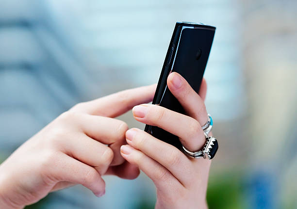 istock Close-up of feminine hands texting on mobile phone 175182470