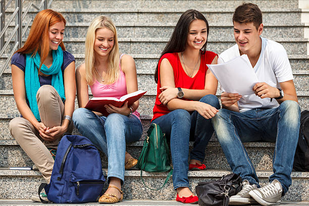 istock Group of university students studying together outdoors 175182582