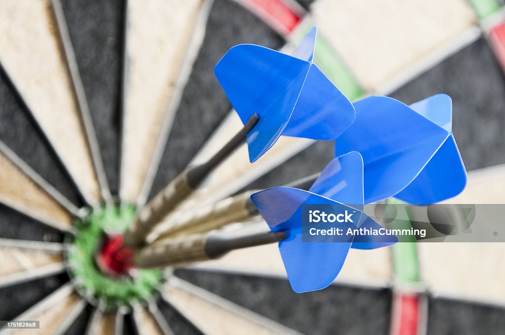 Three darts in the bulls eye on a dart board Three darts at the centre of a dartboard Dart Stock Photo