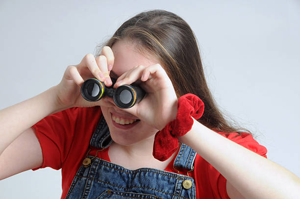 istock Searching - girl looking through a binocular 175183006