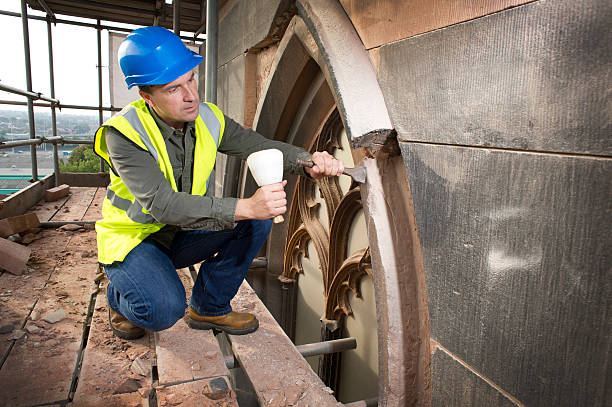 istock stonemason on church restoration 175183360