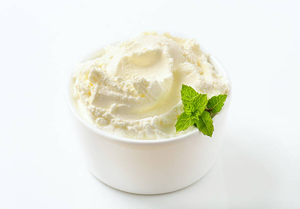 istock Swirl smooth sweet cream cheese in ramekin with mint leaves 175183637
