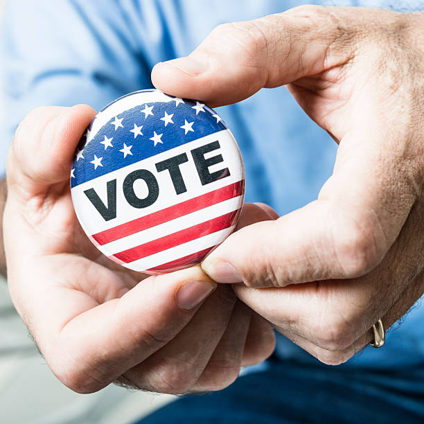 istock Casual man holding a vote button for the election 175183709