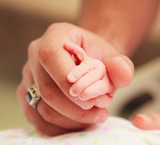 istock Newborn baby is holding 175183981