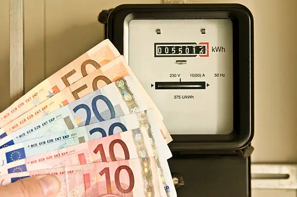 Photo of Electric meter and euro banknotes