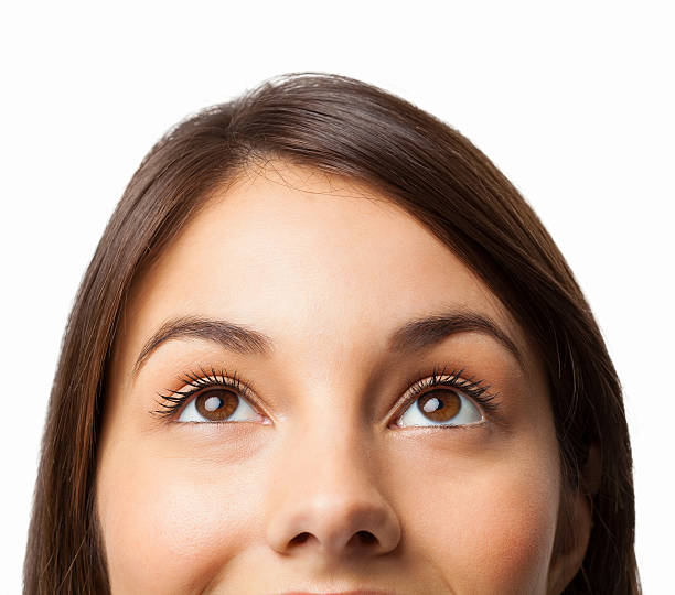 istock A woman with brown hair looking up 175184343