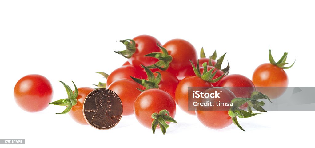 Lit de tomates organiques Penny - Photo de Pièce de monnaie libre de droits