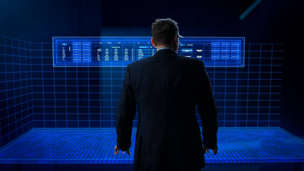 istock Business Analyst Working in a Virtual Reality Office with Augmented Reality Screens. Manager Using a Virtual Touch Screen Hologram with Multiple Options, Generating Visual Presentations from Big Data 1751849594