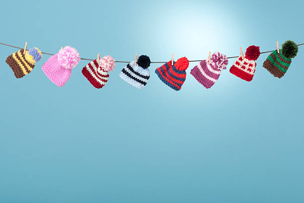 istock Wooly hats hanging from clothes line 175185085