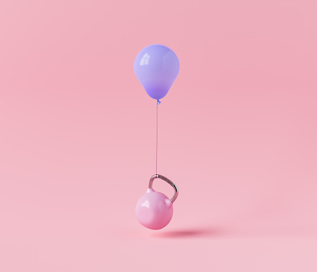 Pink kettle bell floating with a balloon tied to it on a pink studio background. 3d rendering