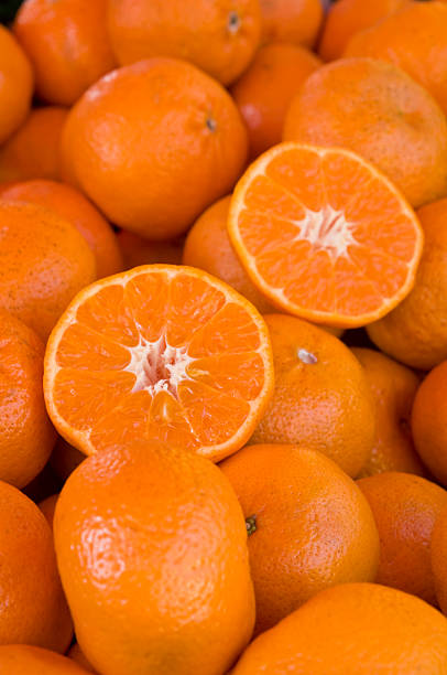 istock Many fresh tangerines at a market stall 175185463