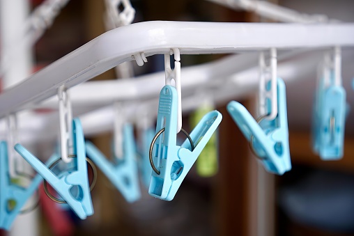 the blue handles of the hangers.