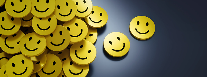 Heap of yellow buttons or badges with smiling face on dark background with copy space - 3D illustration