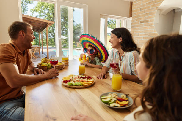 istock Young cheerful family having fun in dining room. 1751860177