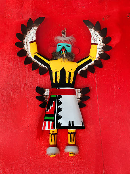 Native American, Hopi Kachina Doll on Red Wooden Board "Native American, Hopi Kachina Doll on Red Wooden Board" kachina doll photos stock pictures, royalty-free photos & images