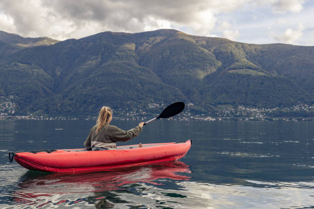 istock Woman canoeing on calm lake 1751870302