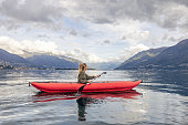 Female kayaking on a lake