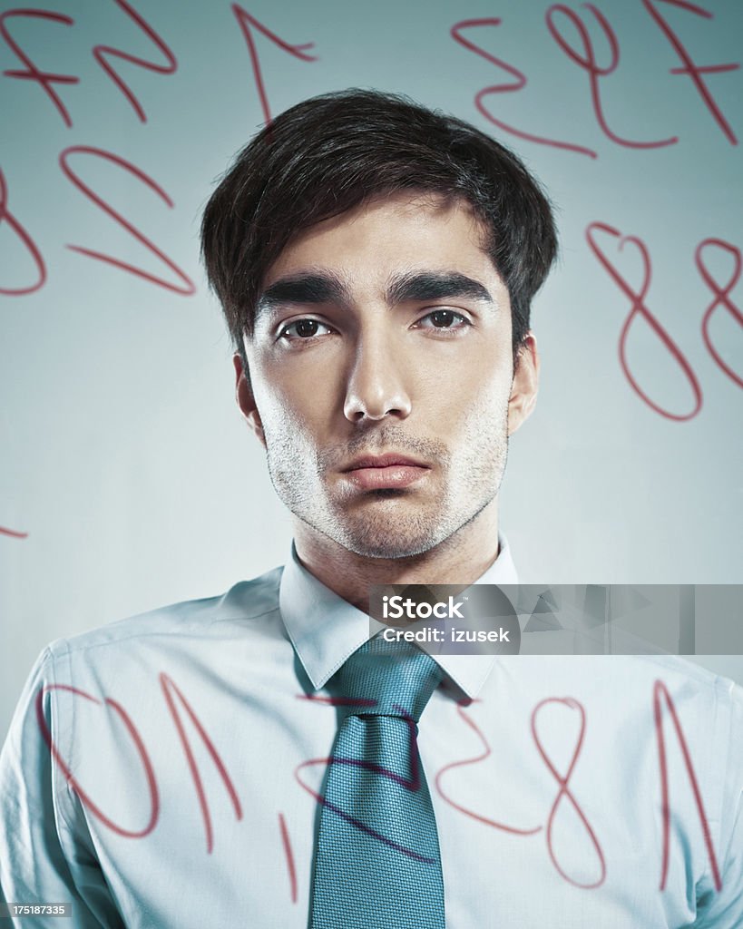Businessman behind transparent board Businessman wearing shirt and tie standing behing on transparent board written by numbers and looking at camera. 25-29 Years Stock Photo