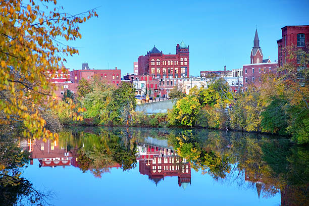 Nashua Downtown Nashua New Hampshire reflection on the Merrimack River. Nashua is the second largest city in the state of New Hampshire. Nashua is known for its  livability and economic expansion as part of the Boston region nashua new hampshire stock pictures, royalty-free photos & images