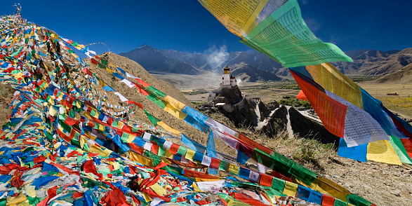 Yungbulakang Palace (or Yumbu Lakhang) and Buddhist prayer flags in the Yarlung Valley in Tibet, China.