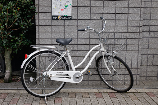 Kyoto, Japan - Dec 25, 2015. A bicycle parking on street at downtown in Kyoto, Japan. Transportation in Japan is also very expensive in international comparison.