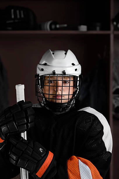 istock Youth Hockey player in dressing room 175188601