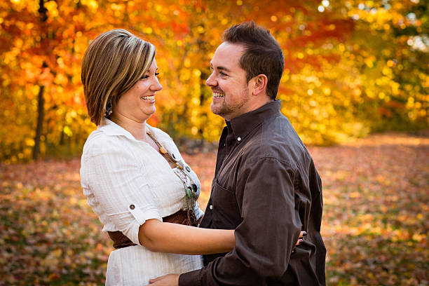 istock Happy Couple Standing Together Outside on Autumn Day 175188613