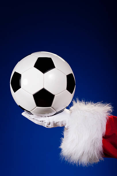 istock Santa Claus holding Soccer ball 175188632