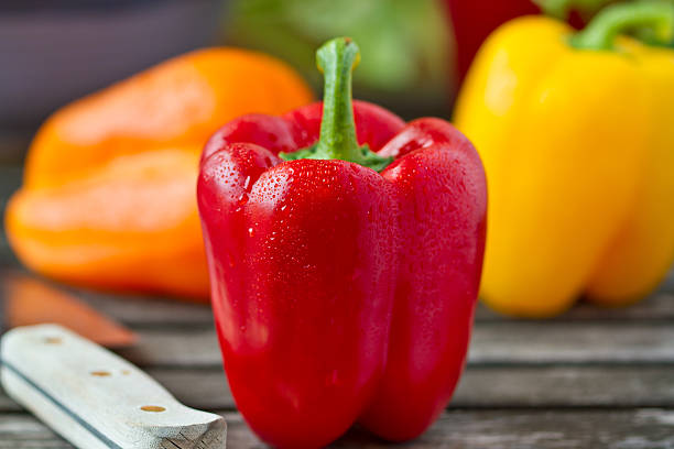Fresh Bell Peppers With Knife stock photo