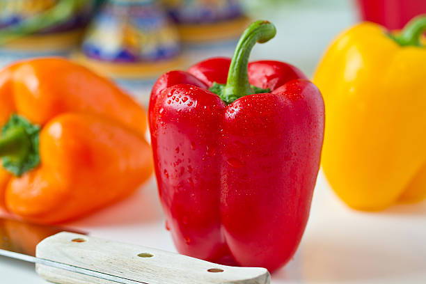 Fresh Bell Peppers With Knife stock photo