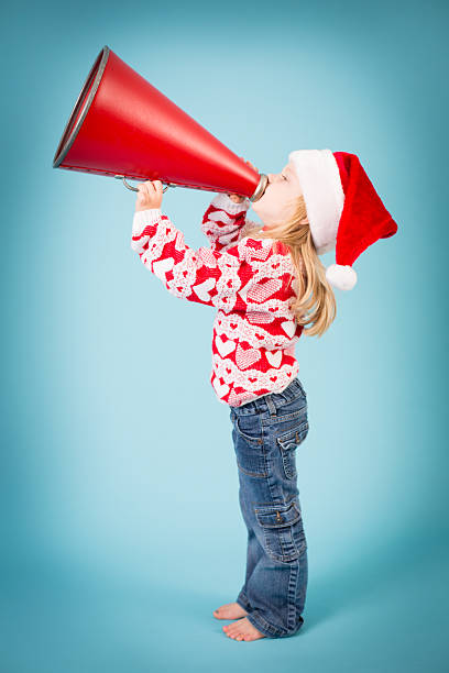 istock Santa's Little Helper Making Announcement With Megaphone 175189065