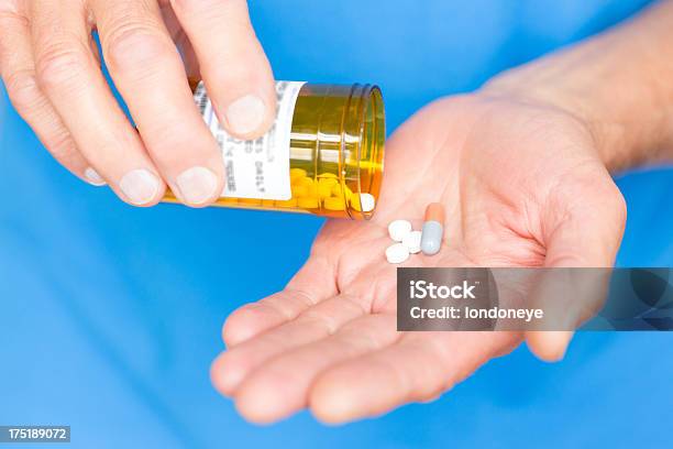 Senior Man Taking Medicines Stock Photo - Download Image Now - Pill, Removing, 60-69 Years