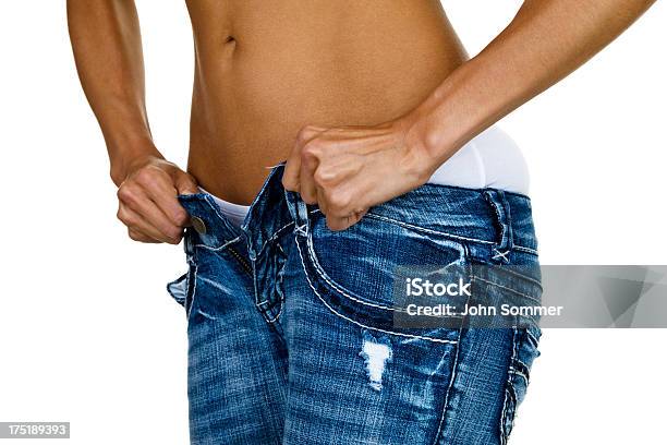 Woman Trying To Button Tight Jeans Stock Photo - Download Image Now - Pants, Too Small, Buttoning