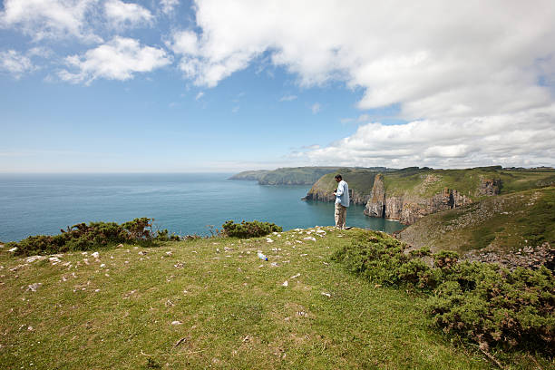istock Mature indian man on Pembrokeshire Coast headland 175189573