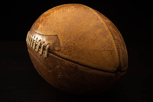 istock Old American Football on Black Background 175190227
