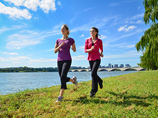 Women Running in Park stock photo