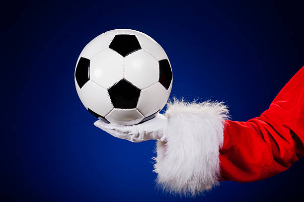 istock Santa Claus holding Soccer ball 175190681