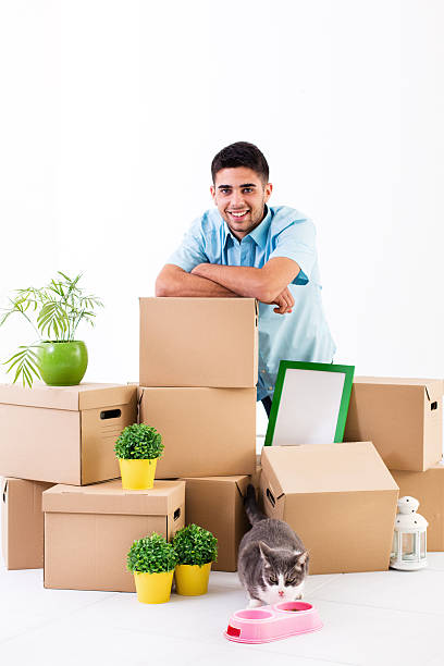 istock Man with moving boxes in new home 175191017