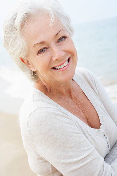 istock Senior Woman Standing On Beach 175192117