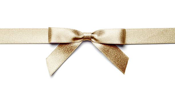 Gold Gift Bow and Ribbon Isolated with Clipping Path An elegant golden ribbon tied into a gift bow, isolated on a white background with clipping path. tied knot photos stock pictures, royalty-free photos & images