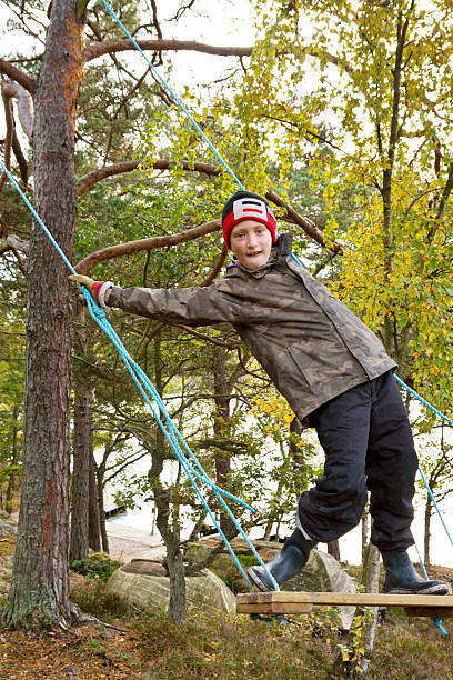 istock Young boy playing on swing in autumn forest 175192221