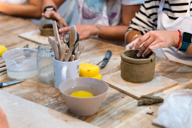 istock Ceramic Workshop. Middle aged woman working on her new ceramic creation 1751923319