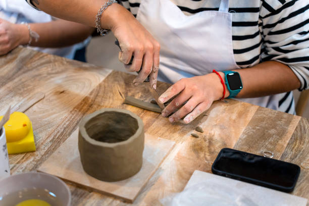 istock Ceramic Workshop. Middle aged woman working on her new ceramic creation 1751923322