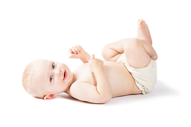 Baby lying on back in cloth diaper with white background stock photo