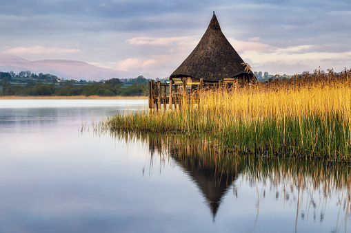 The Crannog at Llangorse Lake in the Brecon Beacons National Park, South Wales, captured shortly after sunrise.