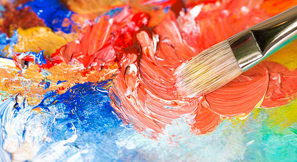 istock Paintbrush with oil paint on a classical palette 175193046