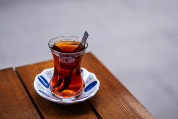 A cup of Turkish tea against the background.
