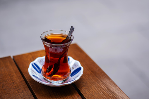 A cup of Turkish tea against the background. Concept of turkish hot drink.