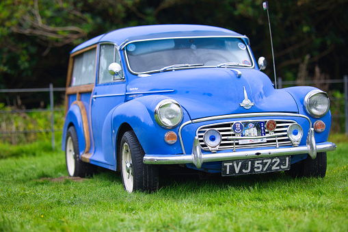Pembrokeshire, United Kingdom - September 10, 2023: Morris Minor car - known as the 'Moggie' and built in England from 1948 until 1972, photographed at a rally at Scolton Manor, Pembrokeshire, Wales, to celebrate the 75th Anniversary of the marque.