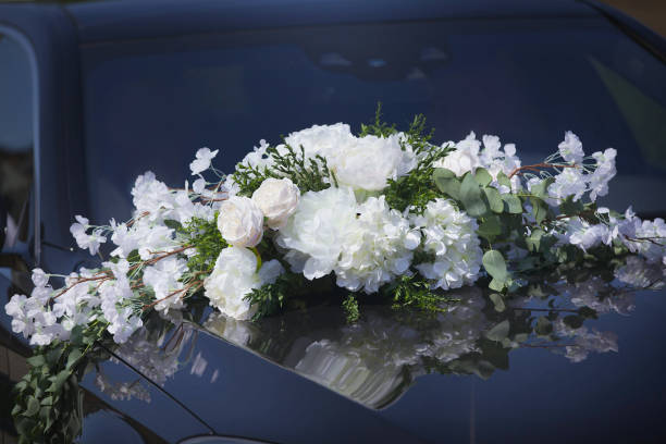 istock The composition from fresh flowers on the holiday car. 1751931068